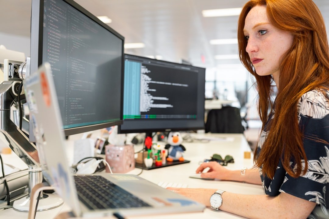 Offerings Female software engineer codes at computer